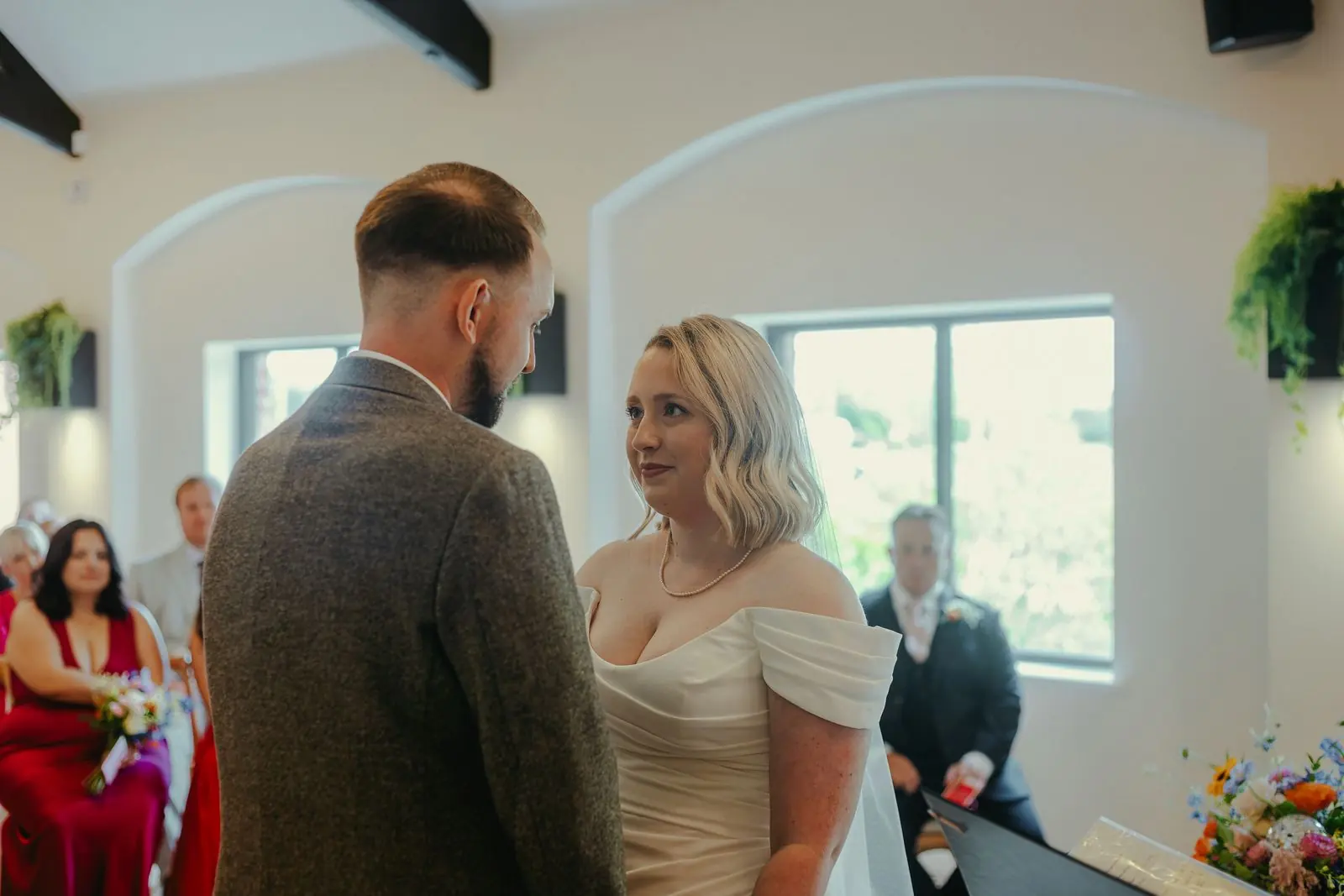 Groom and bride talking at the start of the ceremony
