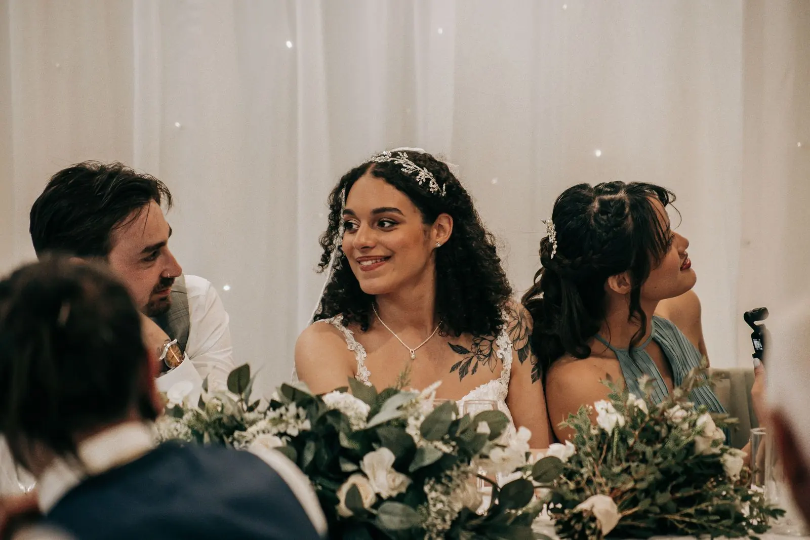 Bride smiling at the top table