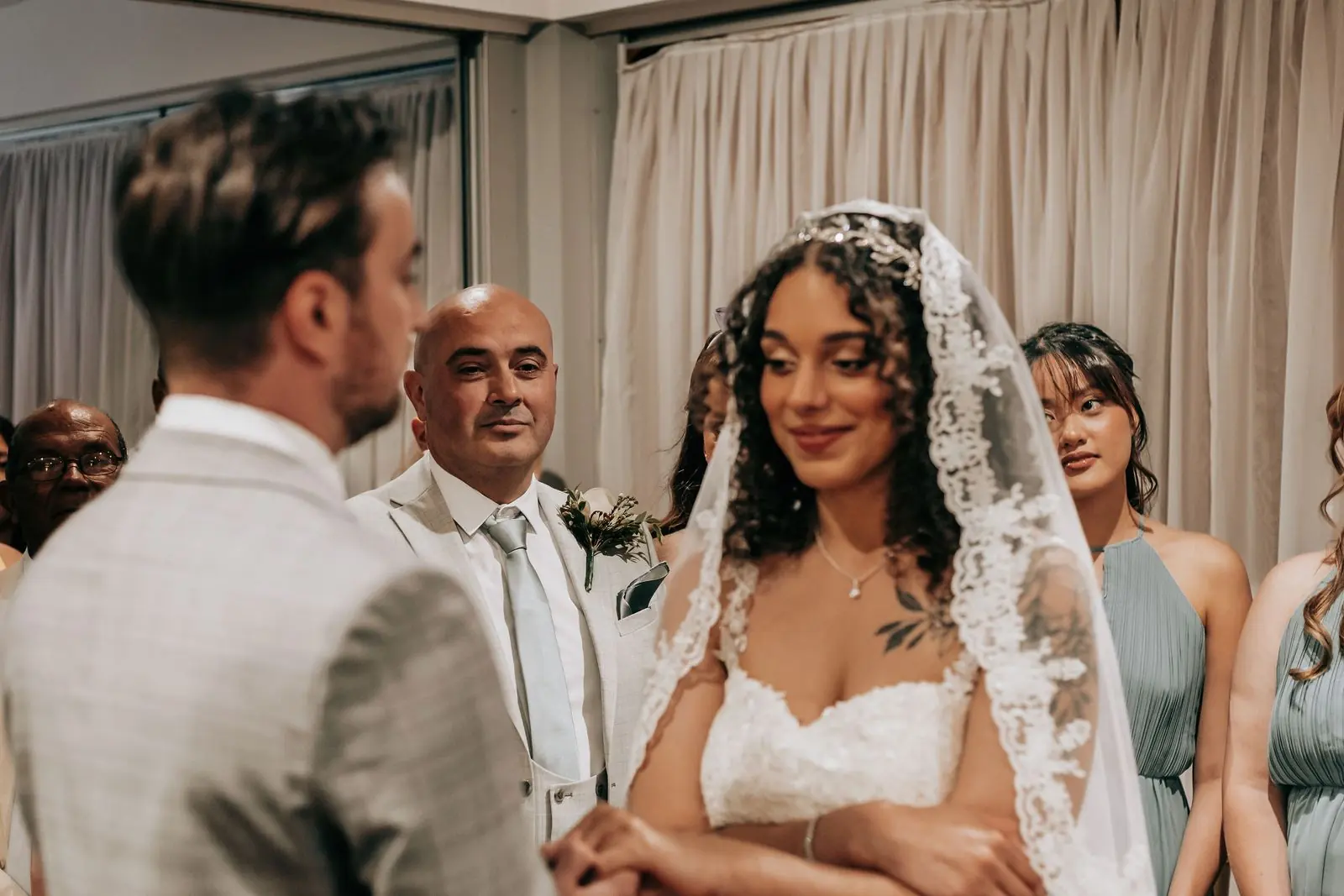 Bride smiling during the vows